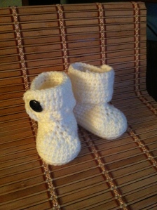 Crocheted White Baby Booties with front wrap around flap